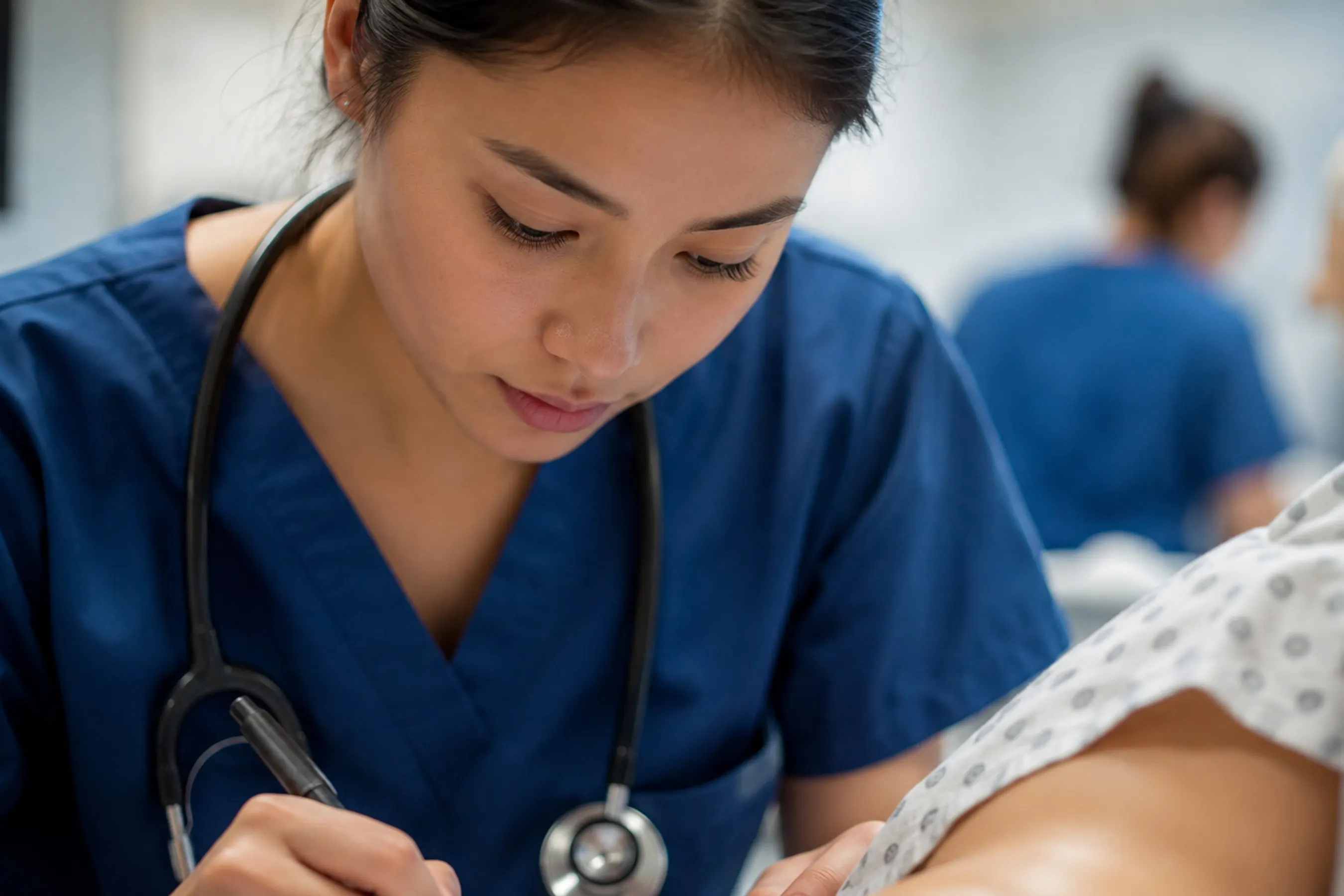 Nursing student providing patient care during clinical training